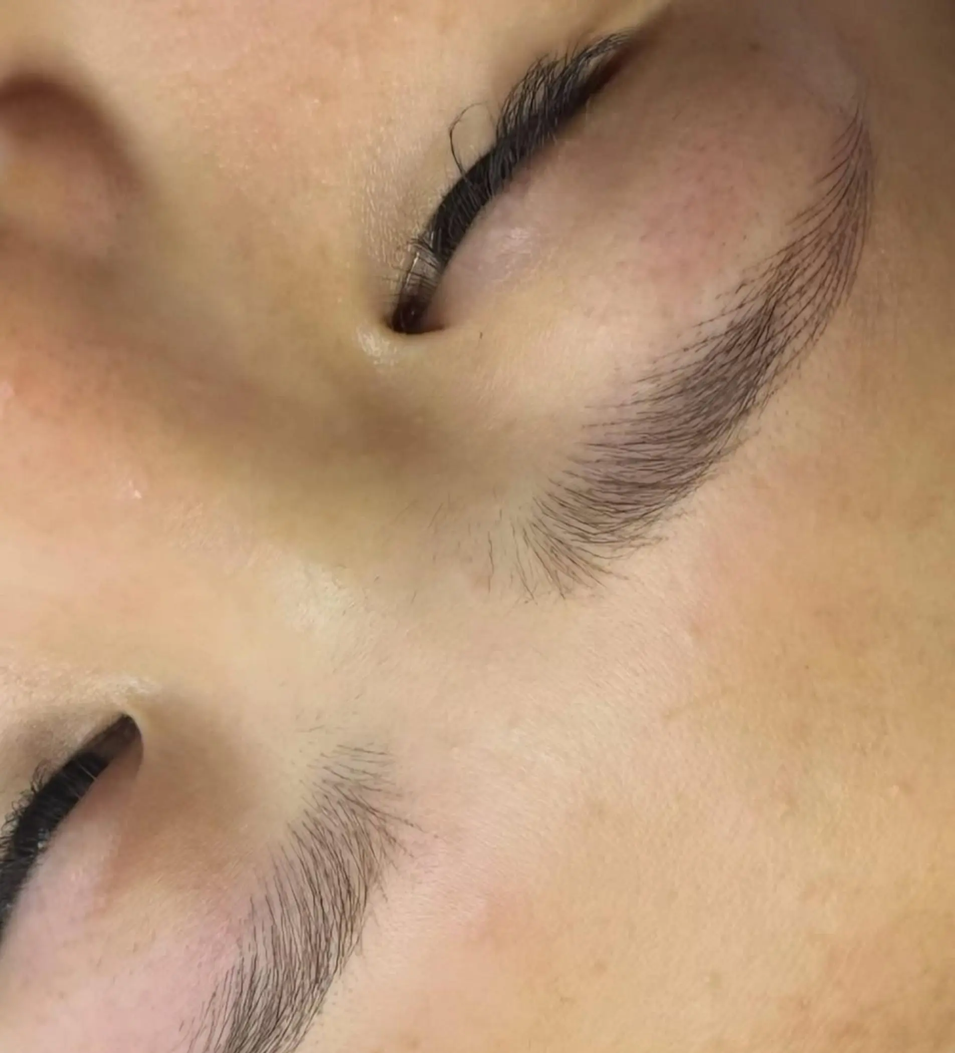 artist working on lip blush permanent makeup