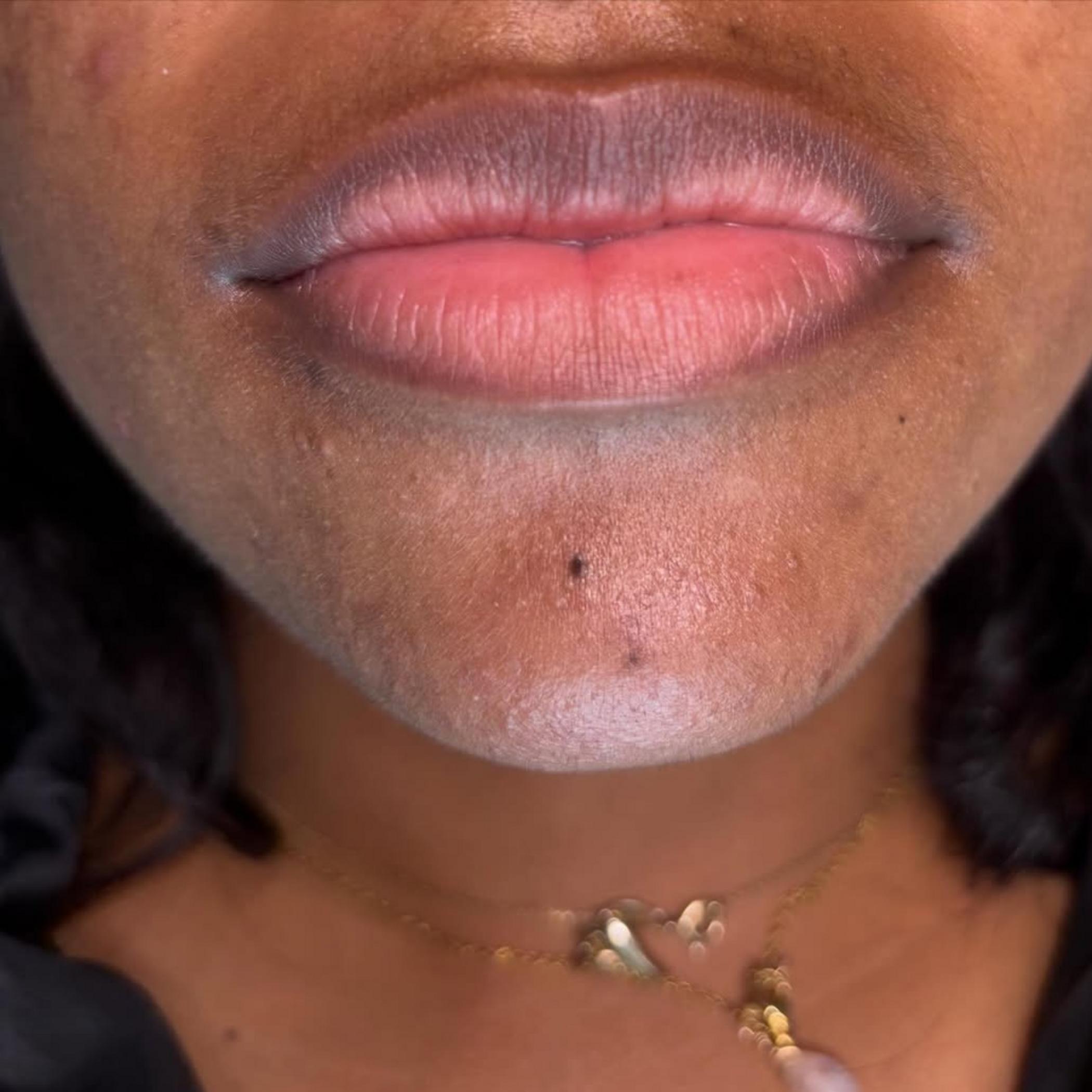 close up healed lip tattoo detail