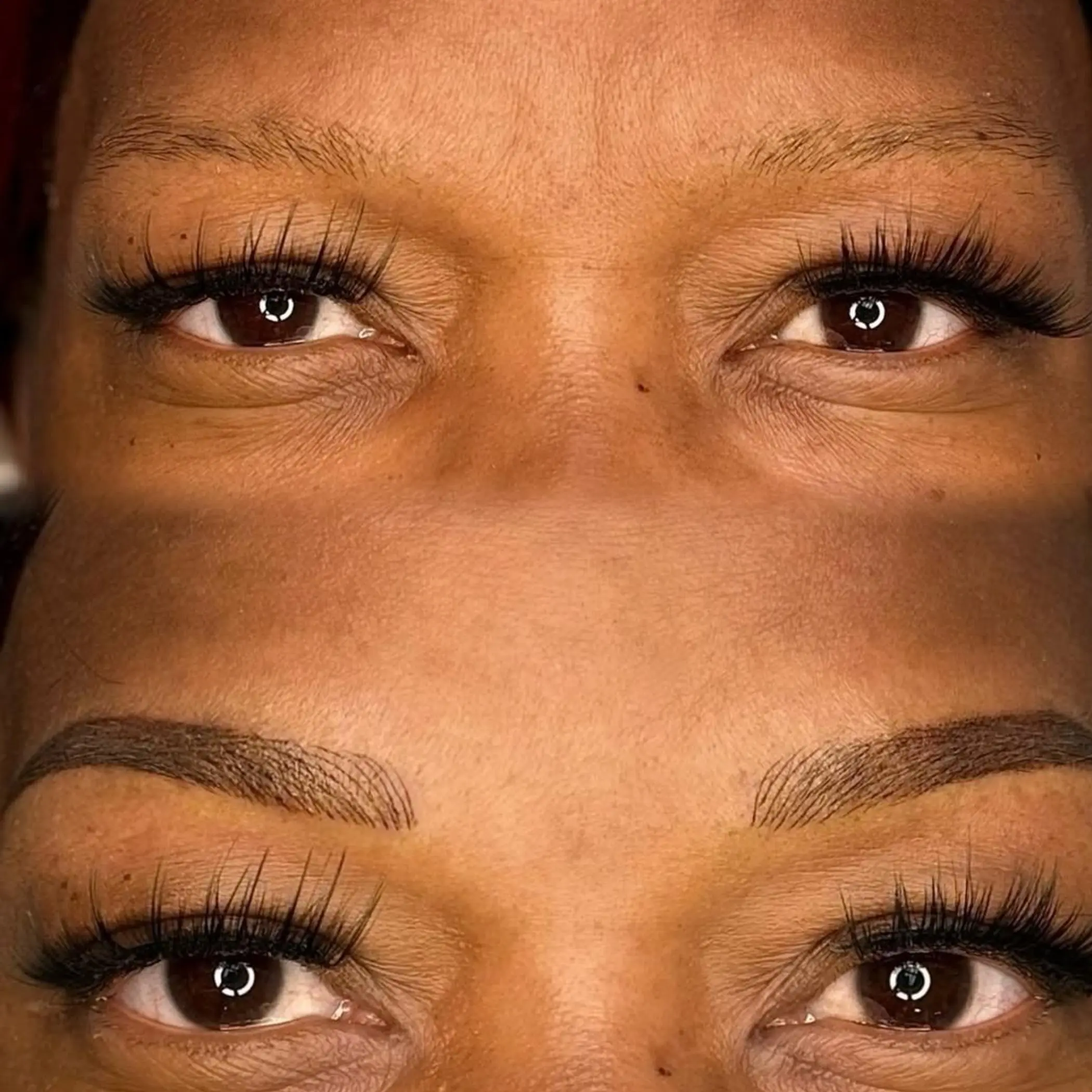 female technician shaping eyebrows client