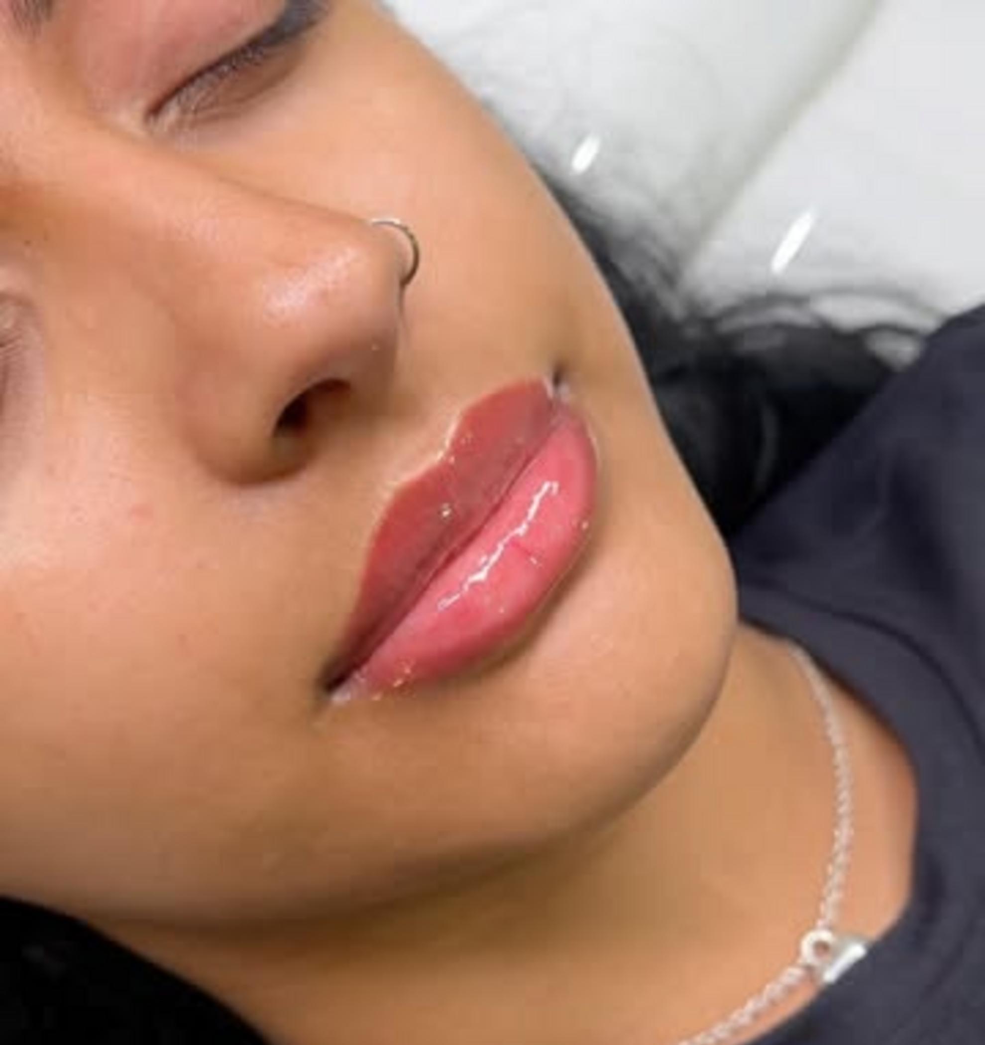 healing stages of lip tattoo closeup