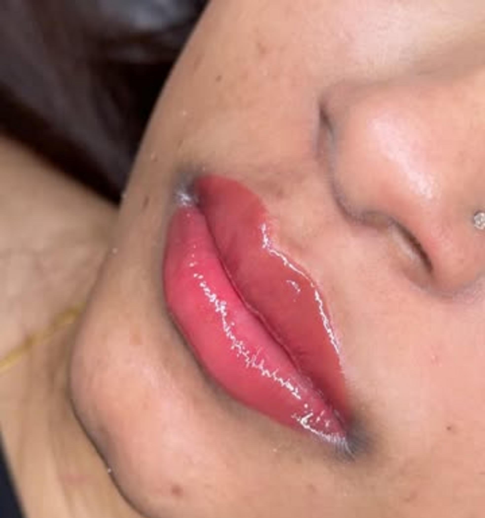 technician applying lip blush